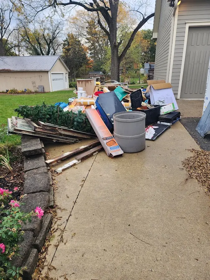 Dumpster being loaded with debris for Commercial Dumpster Rental in Upper Merion
